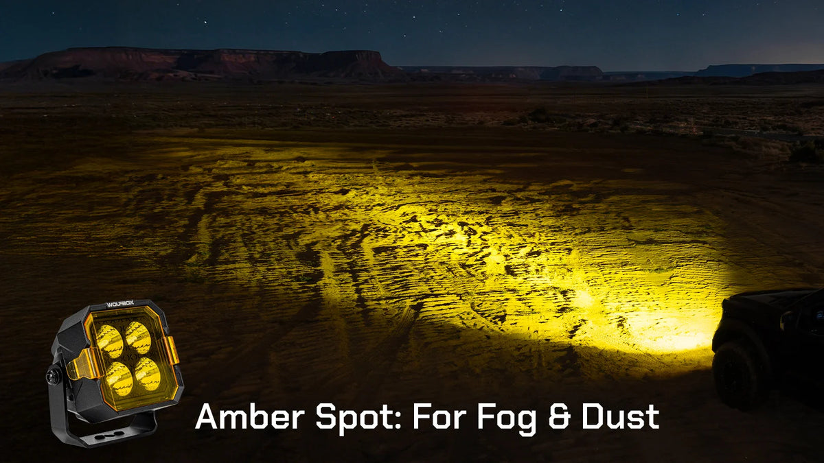 amber spot beam cutting through fog and dust on desert trail